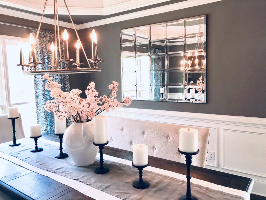 We connected the romance of the formal dining room and the lofty entry way with some gorgeous antique, French style sconces.